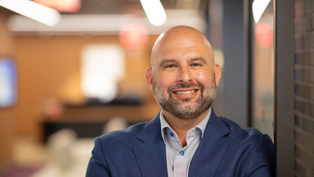 A man smiling for the camera.